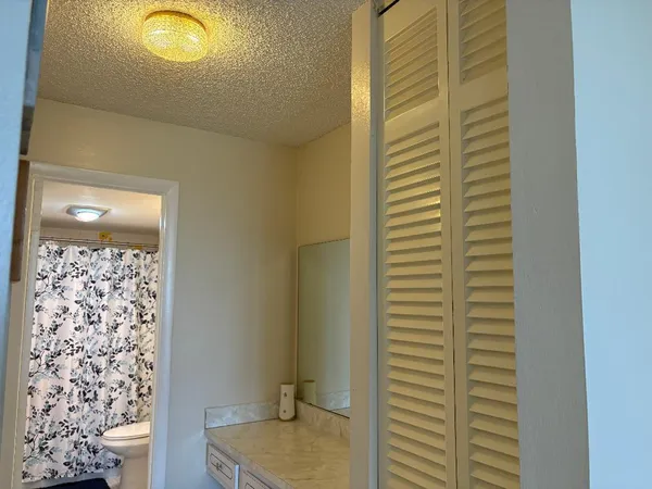 a view of a dining room with furniture and window