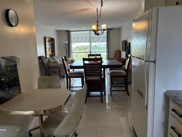 a view of yard with swimming pool and trees