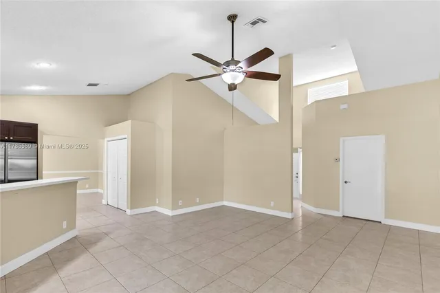 a view of kitchen with microwave and cabinets