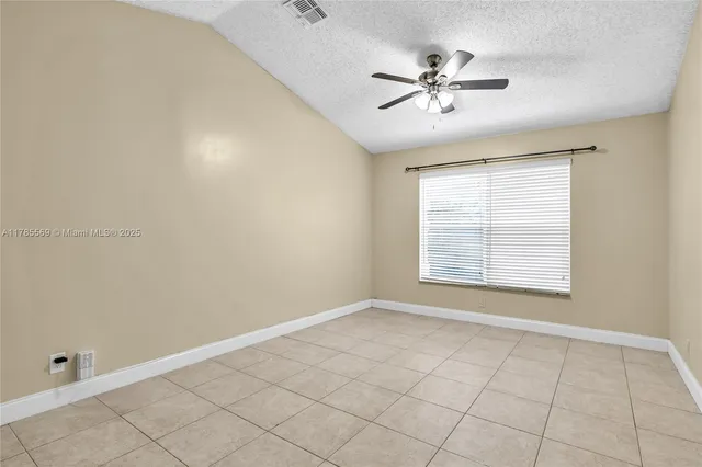 an empty room with a bathroom