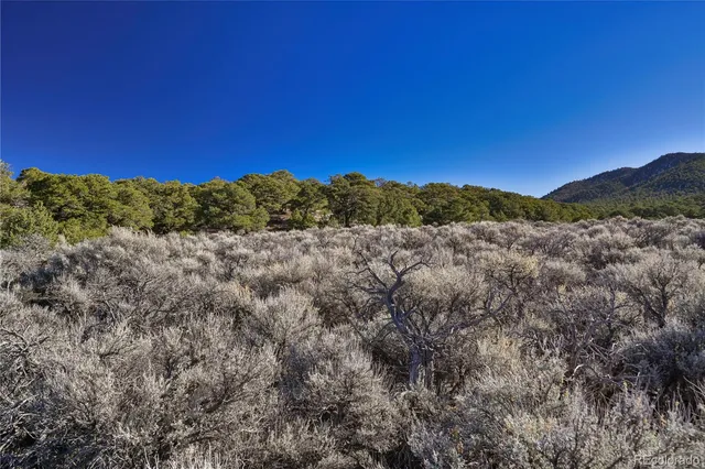 a view of mountain with sunset