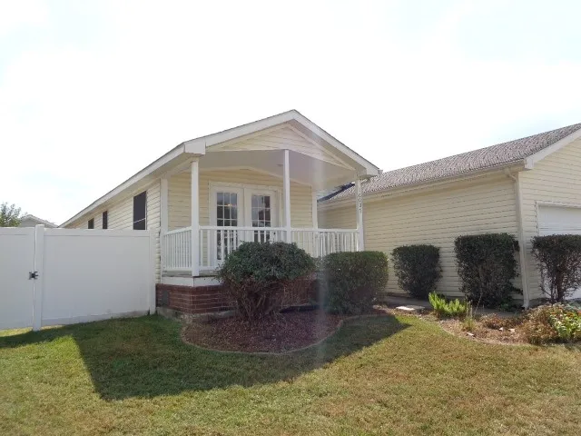 a view of a backyard of the house