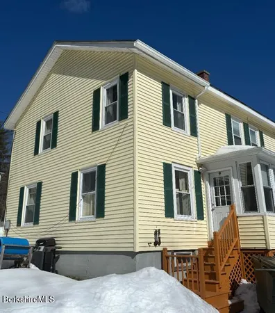 a front view of a house with a balcony