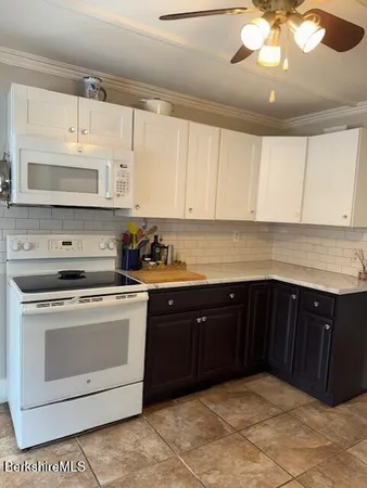 a kitchen with a cabinets and window