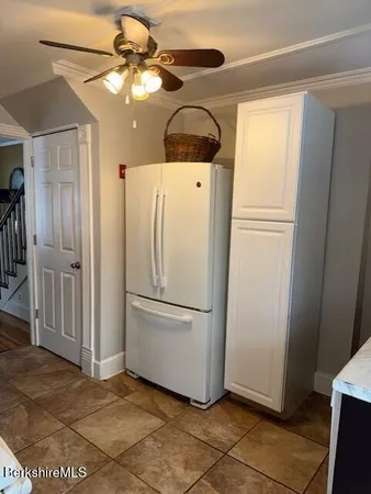 a white refrigerator freezer and a dishwasher in a kitchen
