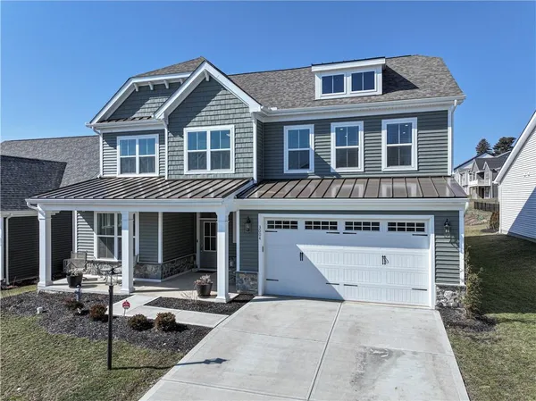 a view of a house with sitting area and garden