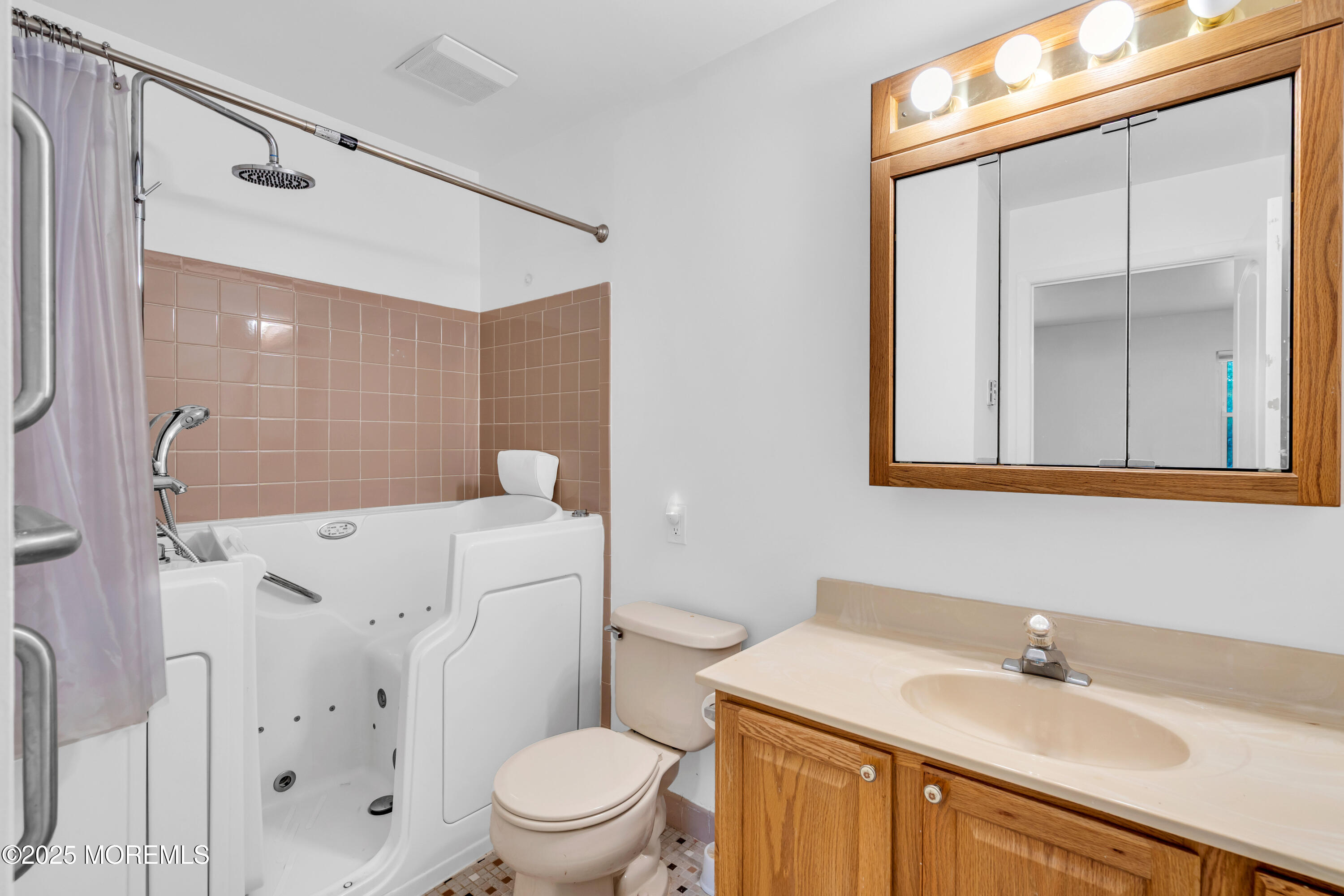 26 Columbus Boulevard, Unit A Whiting, NJ 08759 - Photo 16 of 23 a bathroom with a sink a toilet and shower