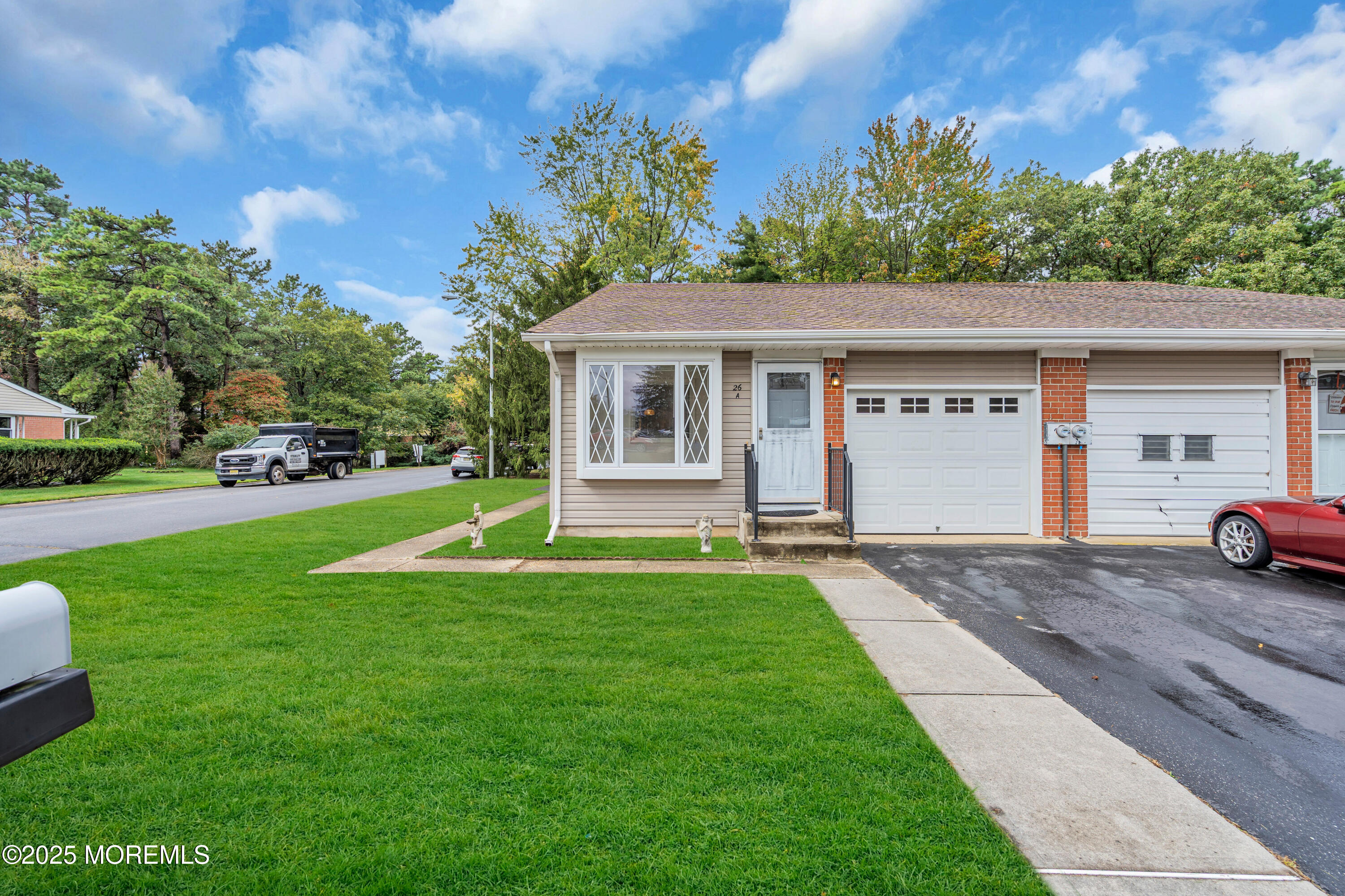 26 Columbus Boulevard, Unit A Whiting, NJ 08759 - Photo 2 of 23 a view of a house with a backyard