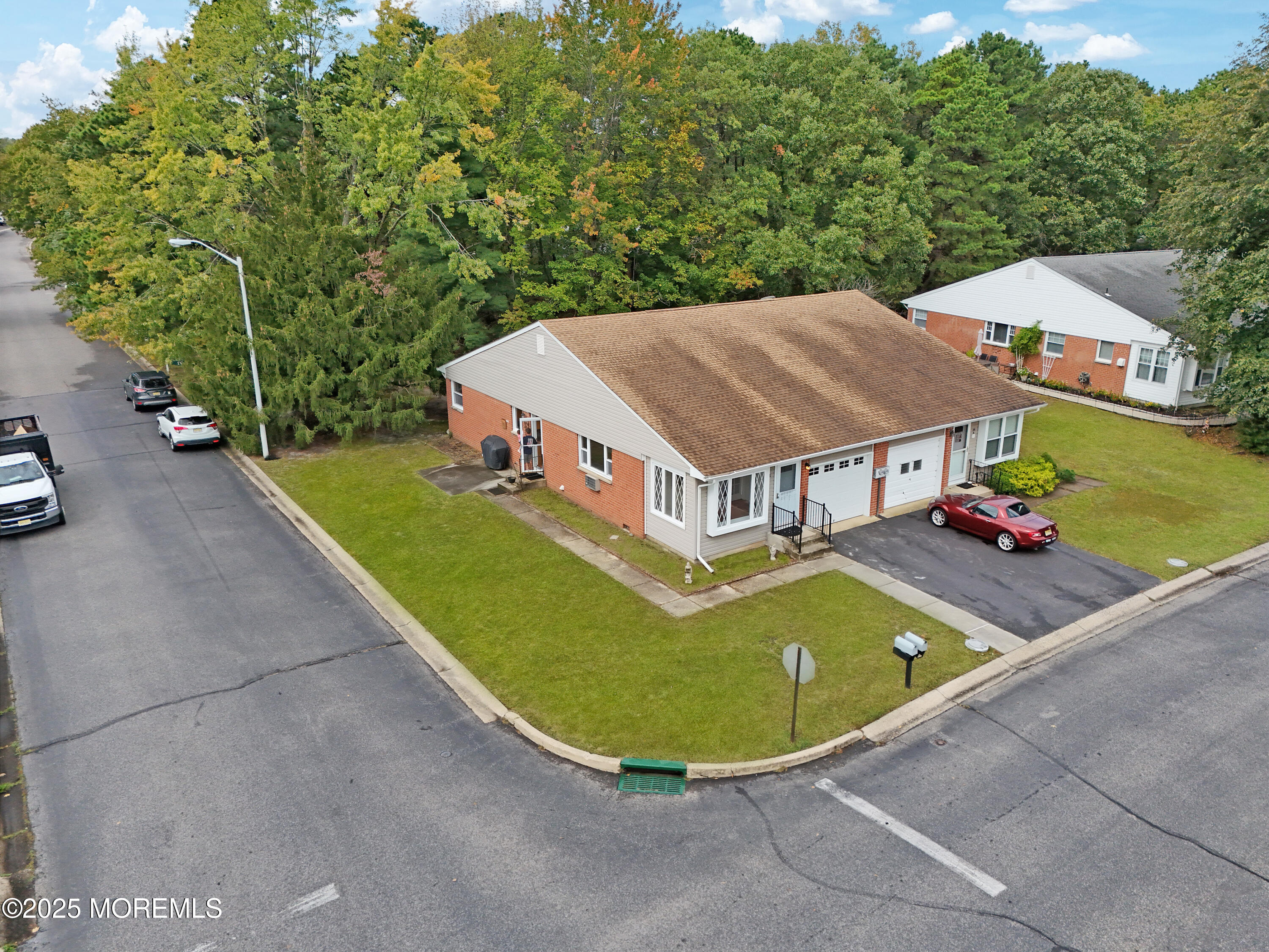 26 Columbus Boulevard, Unit A Whiting, NJ 08759 - Photo 22 of 23 an aerial view of a house with swimming pool and patio