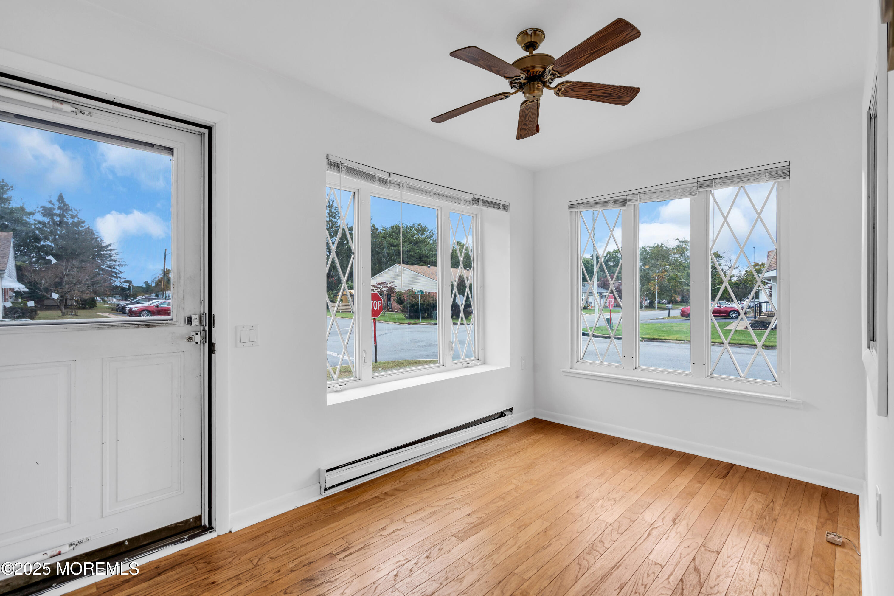 26 Columbus Boulevard, Unit A Whiting, NJ 08759 - Photo 4 of 23 a view of empty room with wooden floor and fan