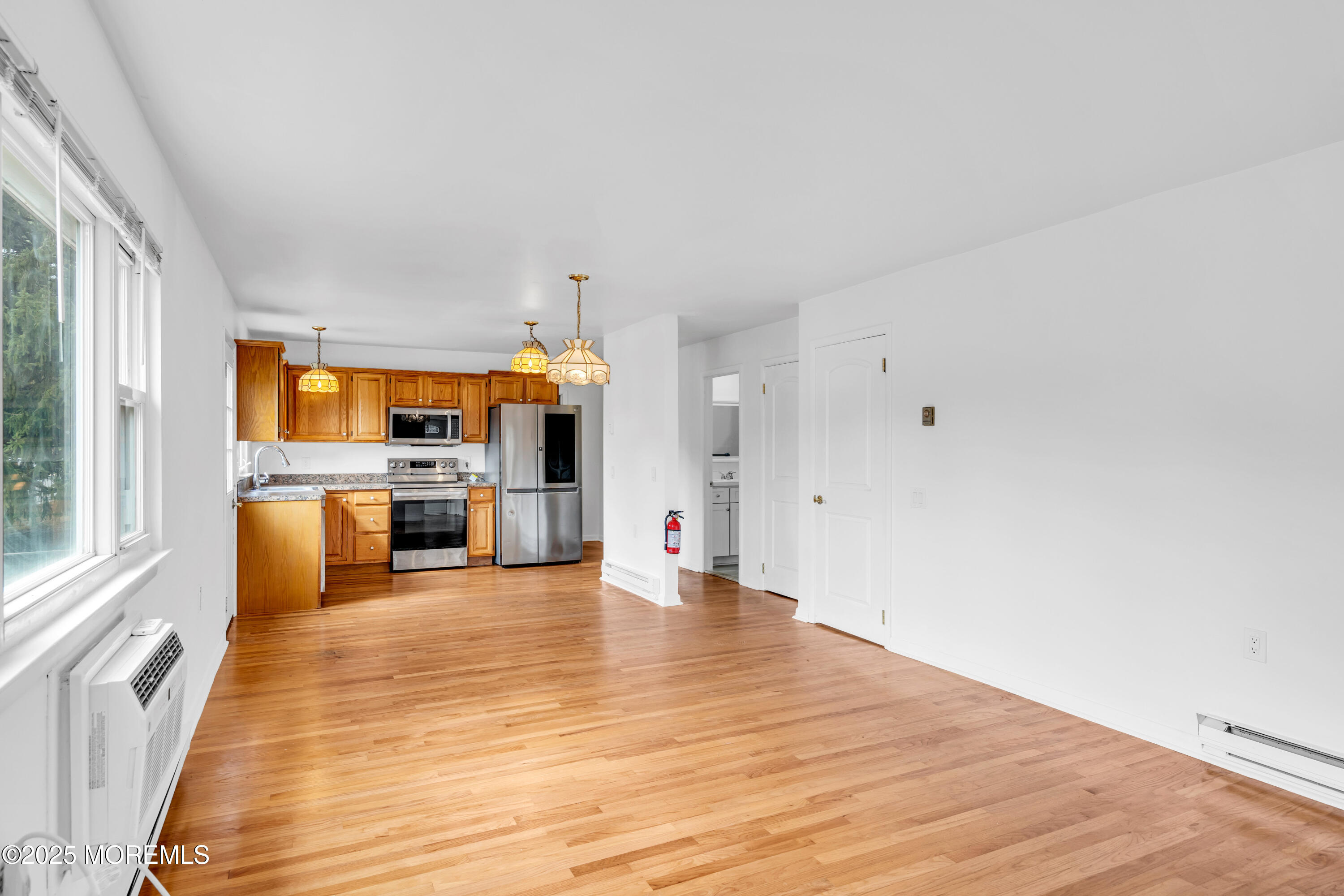 26 Columbus Boulevard, Unit A Whiting, NJ 08759 - Photo 5 of 23 a big room with wooden floor and windows