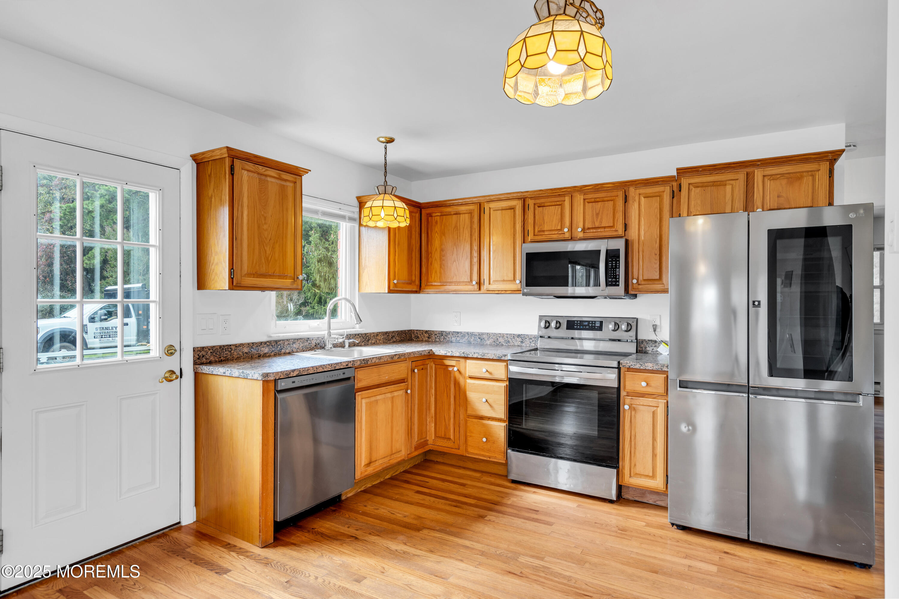 26 Columbus Boulevard, Unit A Whiting, NJ 08759 - Photo 8 of 23 a kitchen with stainless steel appliances granite countertop a stove a sink and a refrigerator