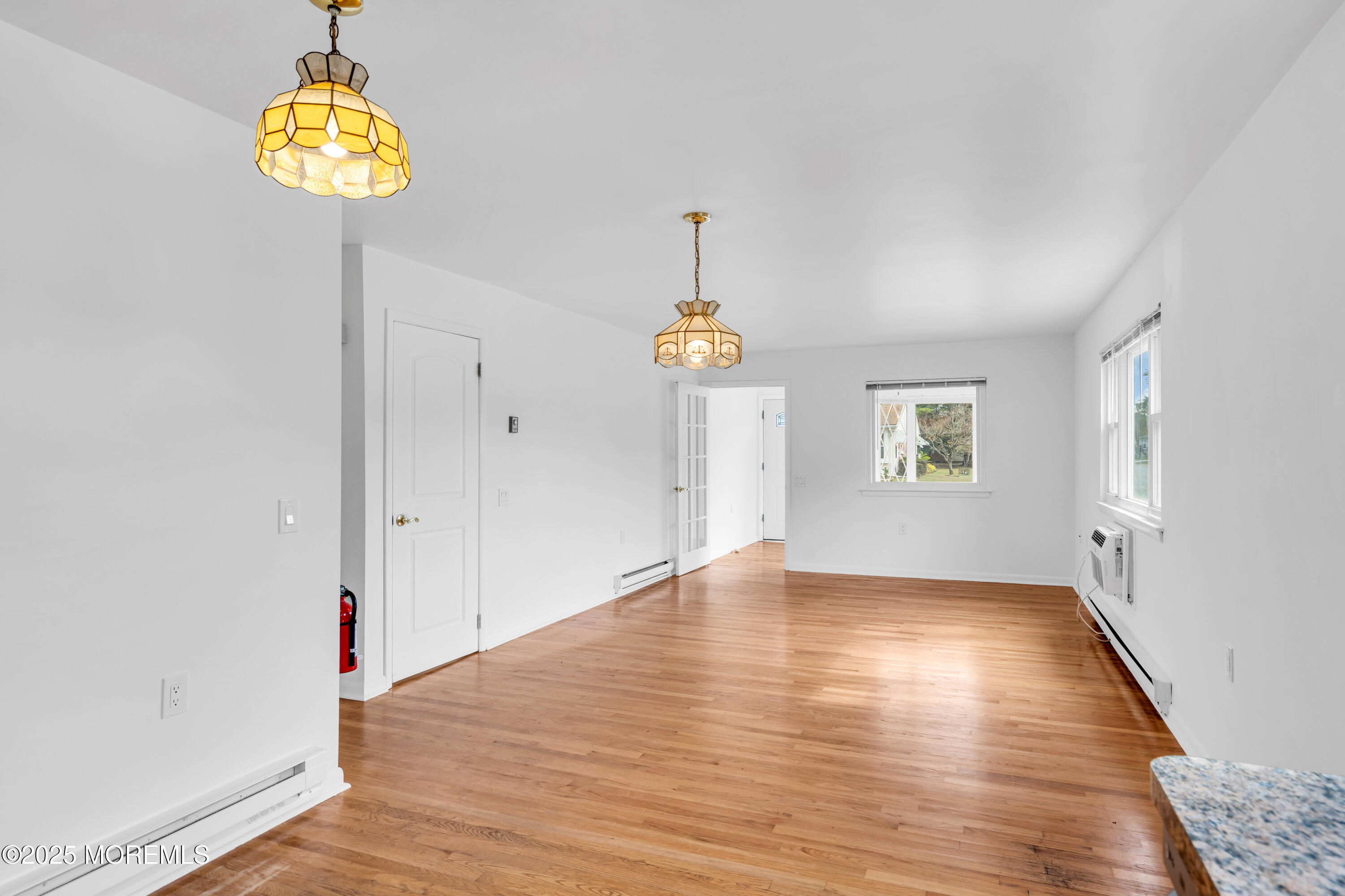 26 Columbus Boulevard, Unit A Whiting, NJ 08759 - Photo 10 of 23 wooden floor in an empty room with a window