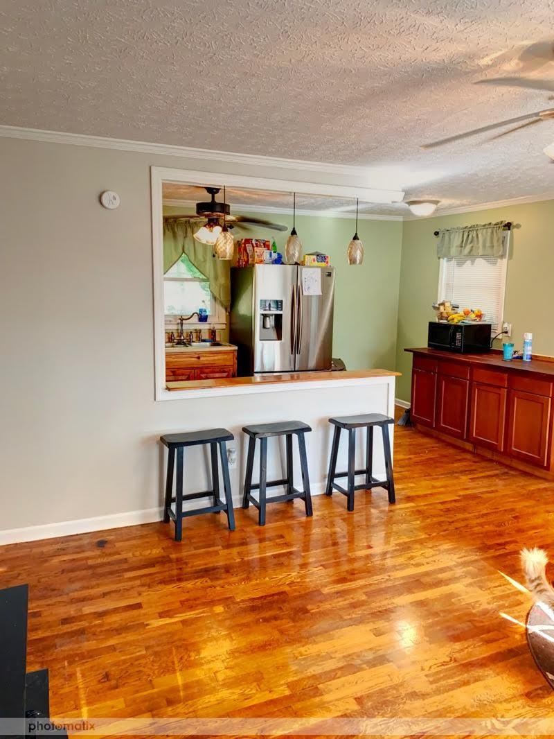 485 Powder House Road Powell, TN 37849 - Photo 4 of 24 a view of a room with furniture and wooden floor