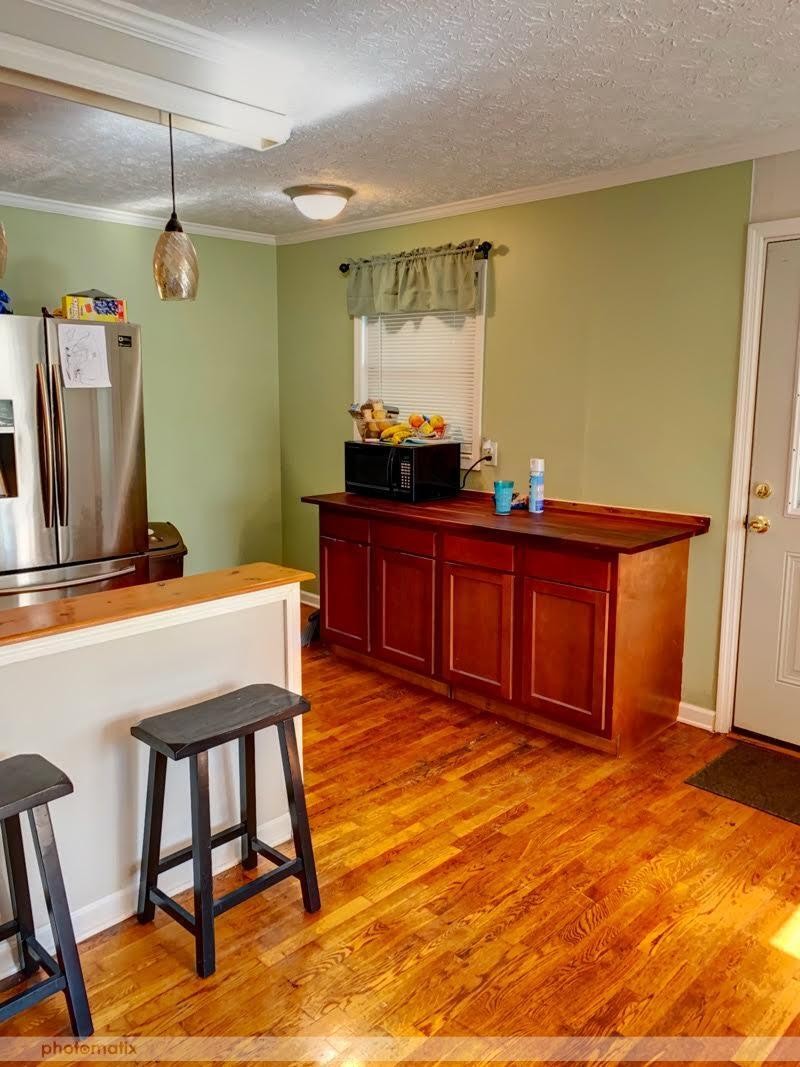 485 Powder House Road Powell, TN 37849 - Photo 5 of 24 a room with table chairs and wooden floor