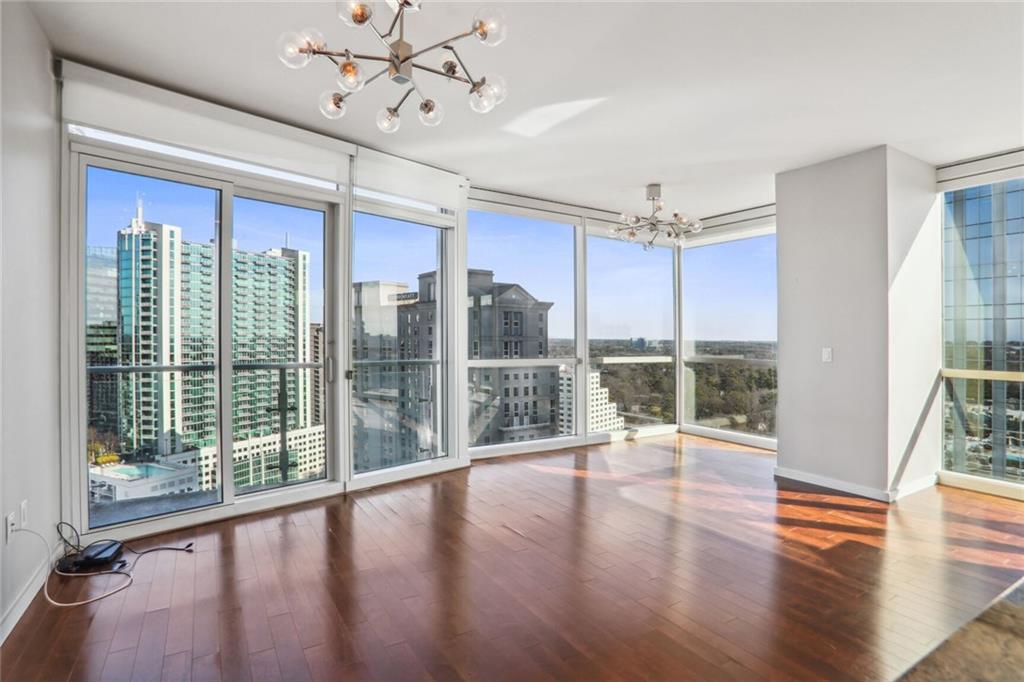 3325 Piedmont Road Northeast, Unit 2007 Atlanta, GA 30305 - Photo 1 of 1 a view of an entryway with wooden floor and windows