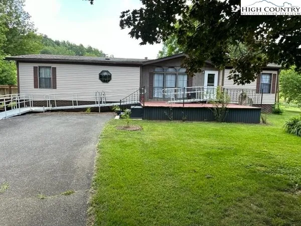 a front view of house with yard and seating area