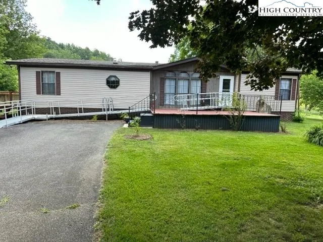 a front view of house with yard and seating area