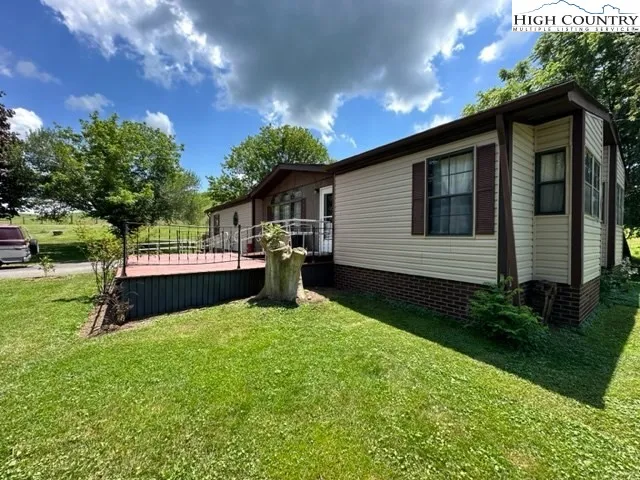 a kitchen with stainless steel appliances granite countertop a sink and a refrigerator