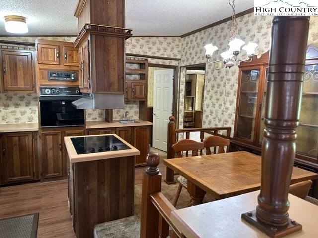 32 Stoneacres Lane Independence, VA 24348 - Photo 15 of 27 a kitchen with granite countertop a sink and a stove