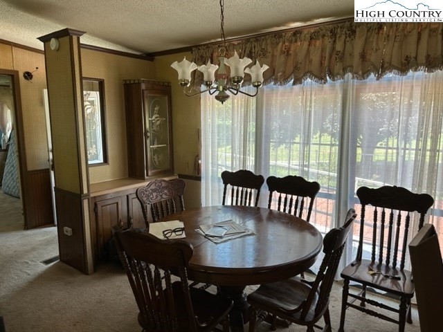 32 Stoneacres Lane Independence, VA 24348 - Photo 17 of 27 a view of a dining room with furniture window and wooden floor