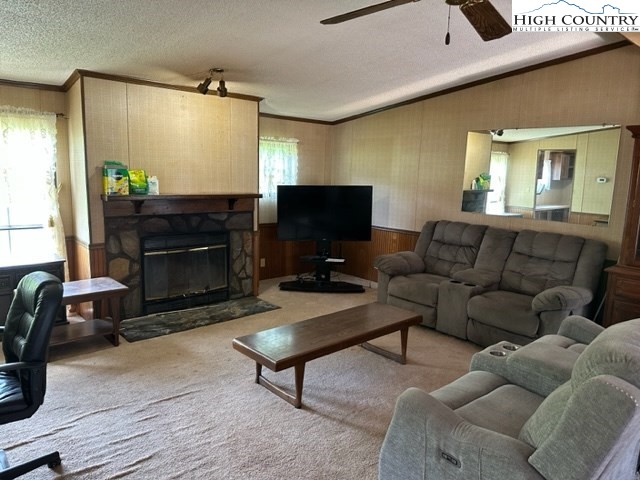 32 Stoneacres Lane Independence, VA 24348 - Photo 18 of 27 a living room with furniture a flat screen tv and a fireplace