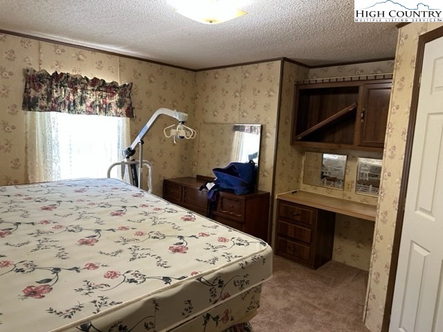 32 Stoneacres Lane Independence, VA 24348 - Photo 23 of 27 a bed room with a bed and a television