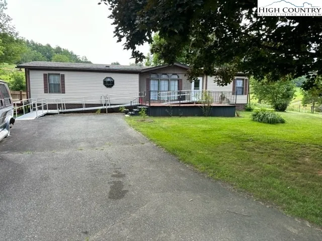 a front view of house with yard and patio