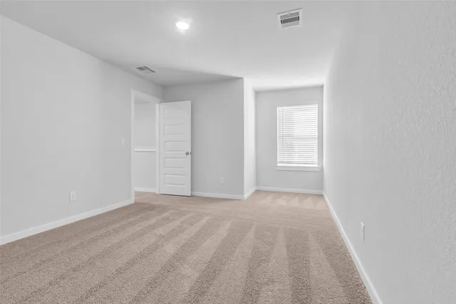 a view of an empty room and window