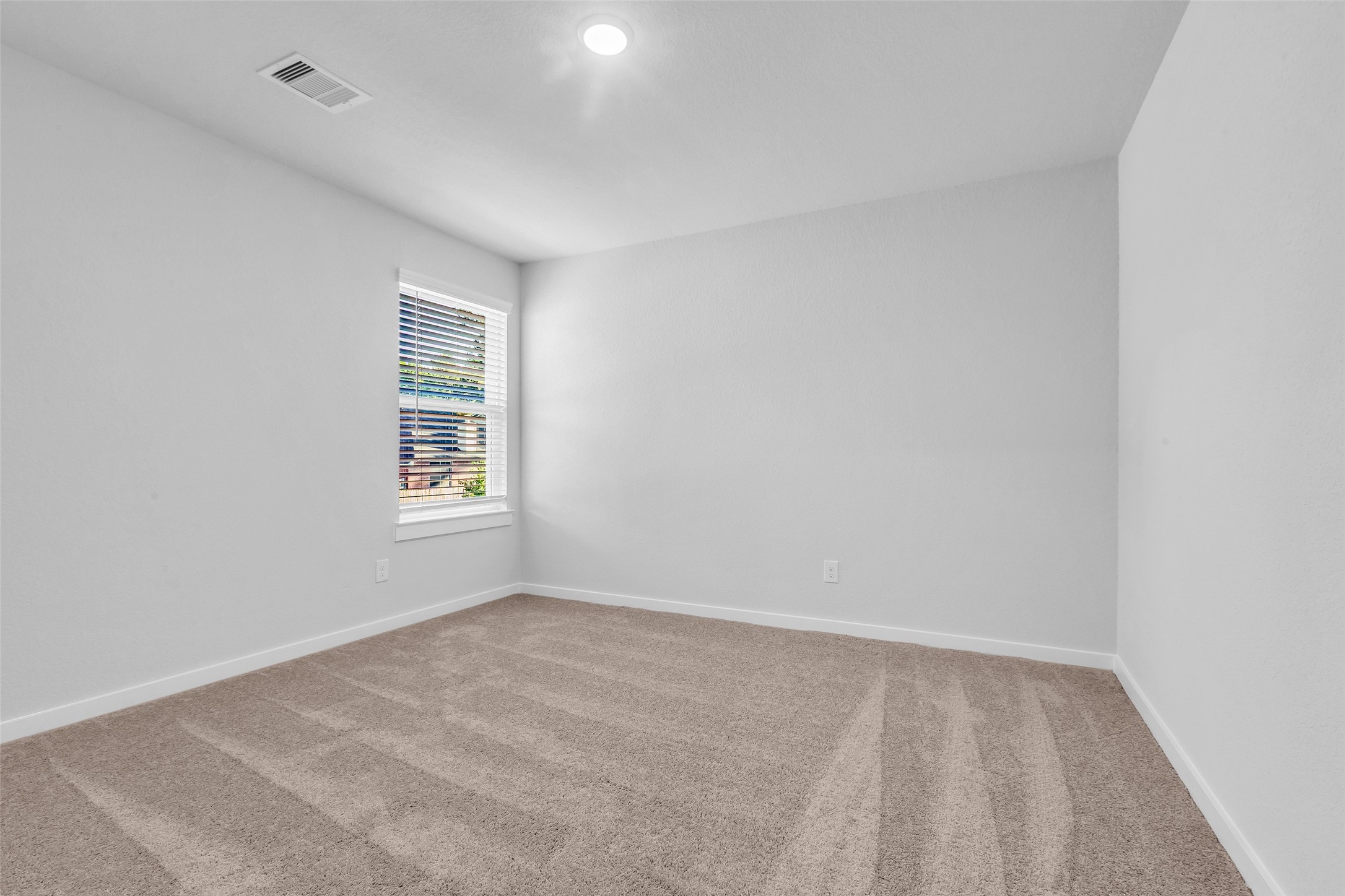 8550 Blueberry Ash Street Magnolia, TX 77354 - Photo 24 of 40 an empty room with windows