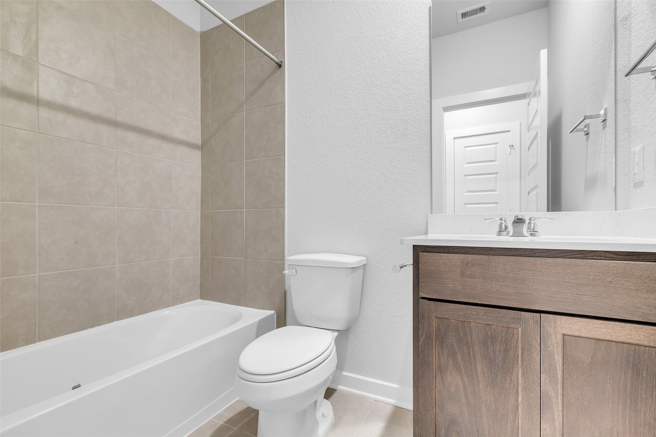 8550 Blueberry Ash Street Magnolia, TX 77354 - Photo 30 of 40 a bathroom with a sink a toilet and a bathtub