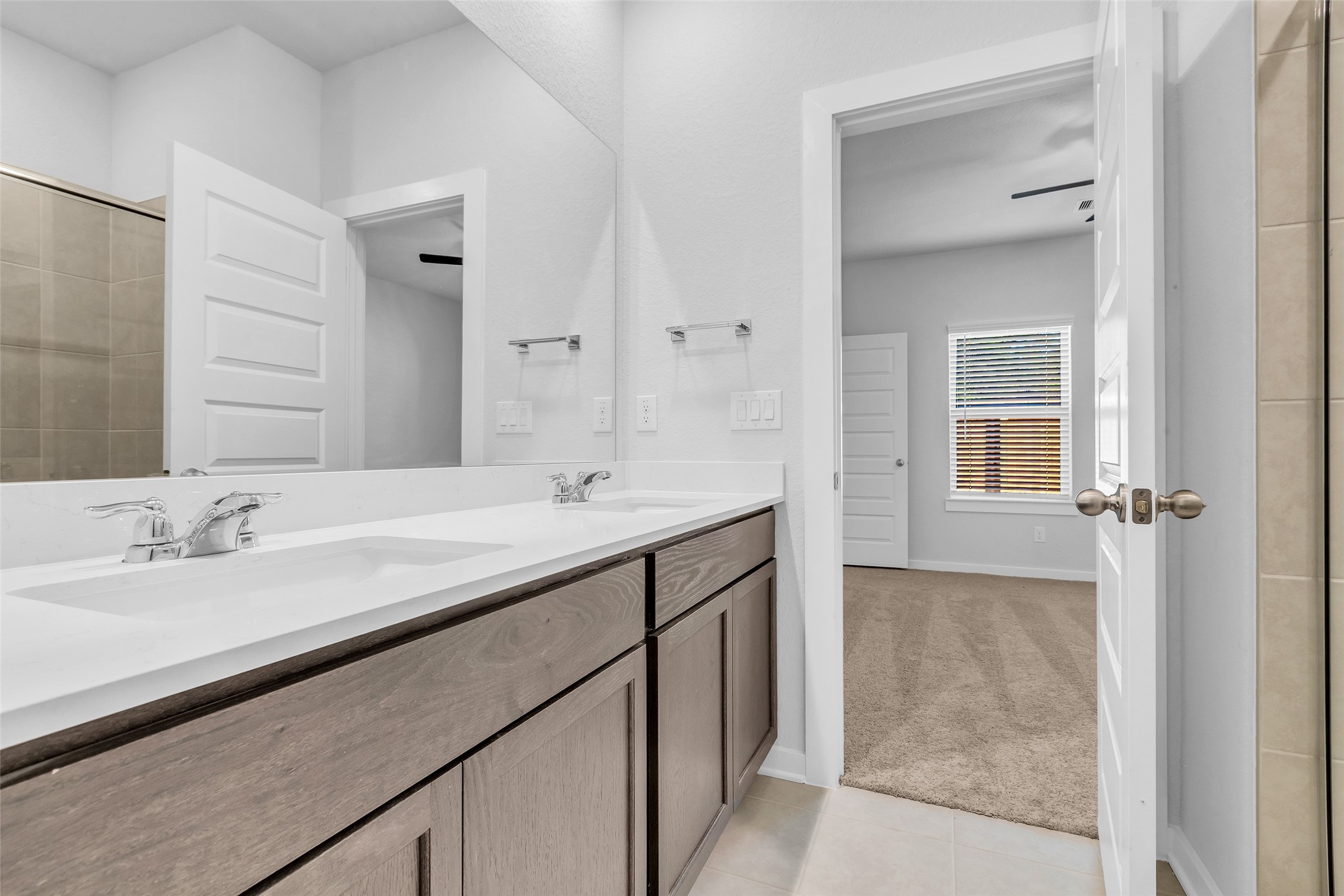 8550 Blueberry Ash Street Magnolia, TX 77354 - Photo 31 of 40 a bathroom with a sink and a mirror