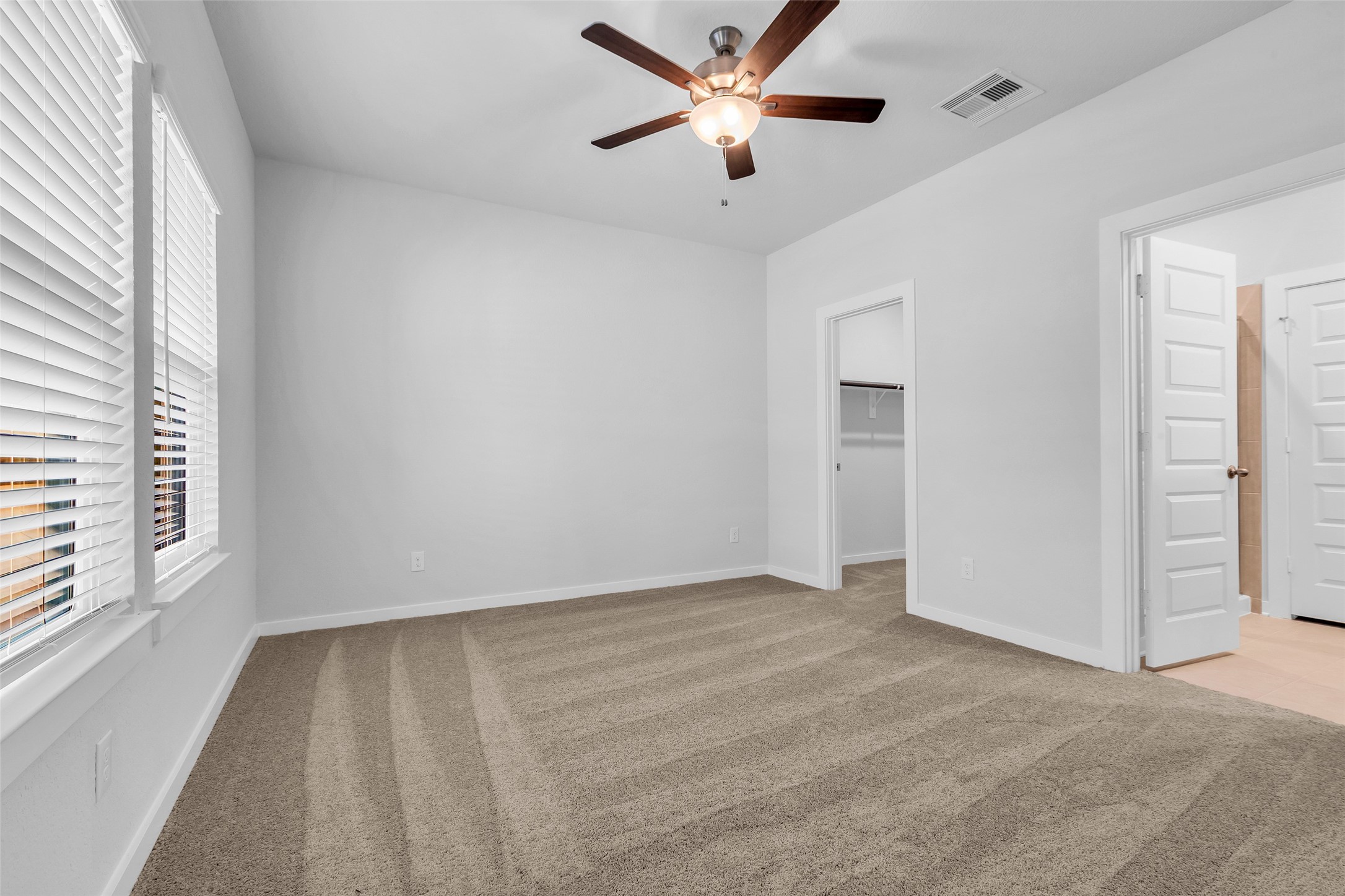 8550 Blueberry Ash Street Magnolia, TX 77354 - Photo 35 of 40 wooden floor in an empty room with a window