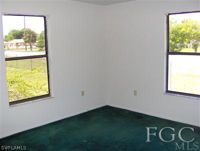 18512 Holly Road Fort Myers, FL 33967 - Photo 8 of 10 a view of an empty room with a window