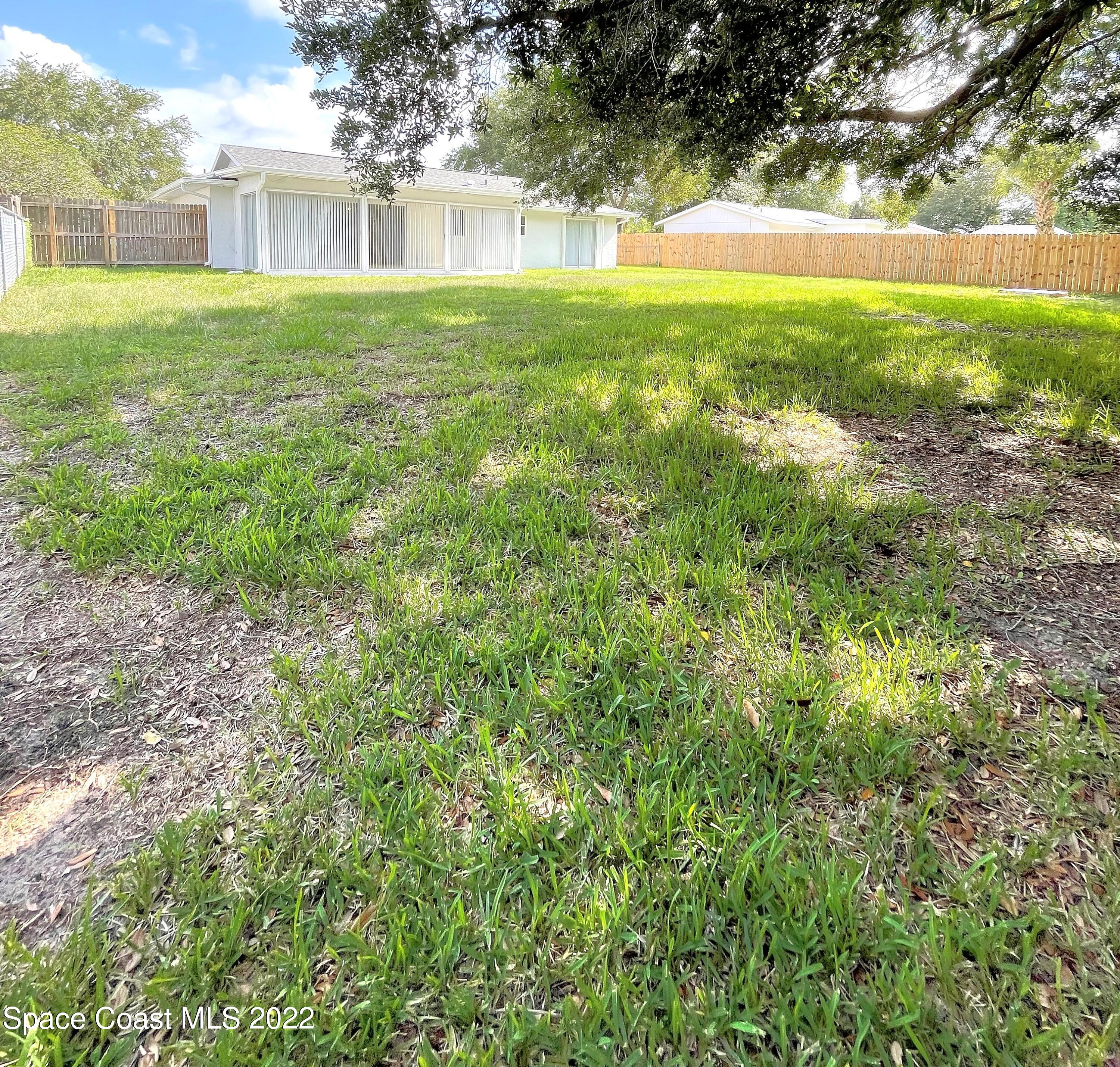 1440 Creel Road Northeast Palm Bay, FL 32905 - Photo 6 of 27 a view of yard with green space