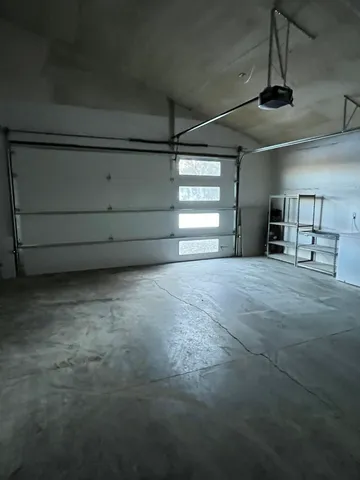 a view of a livingroom with an empty space and window