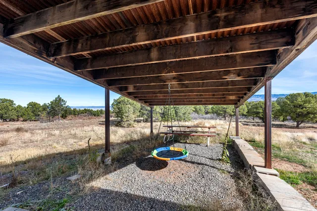 a view of swimming pool with outdoor seating