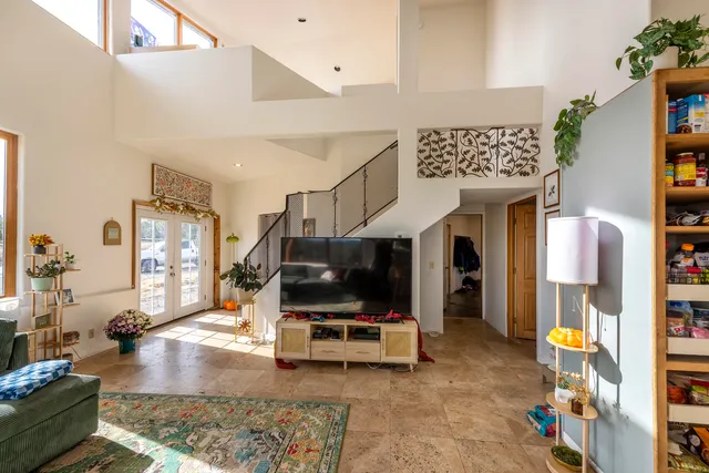 a living room with furniture and a rug
