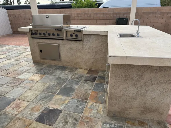 a view of barbeque grill with granite counter top