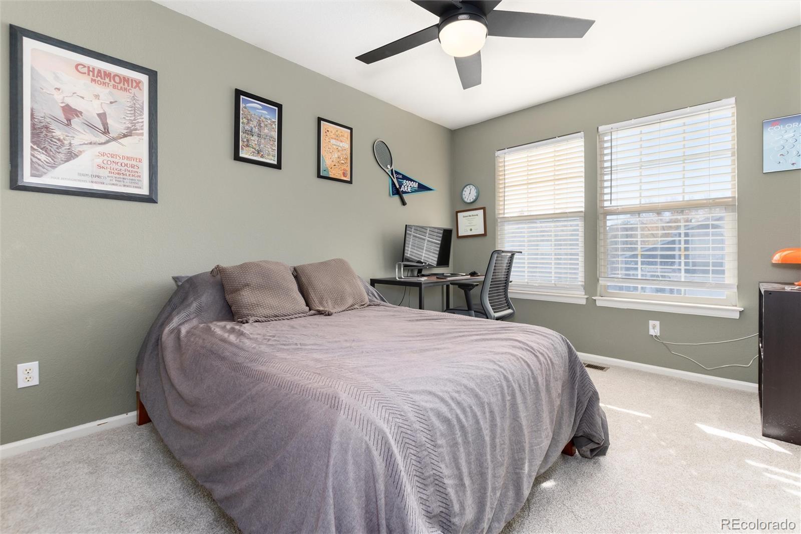 9867 Aftonwood Street Highlands Ranch, CO 80126 - Photo 21 of 41 a spacious bedroom with a bed and a large window