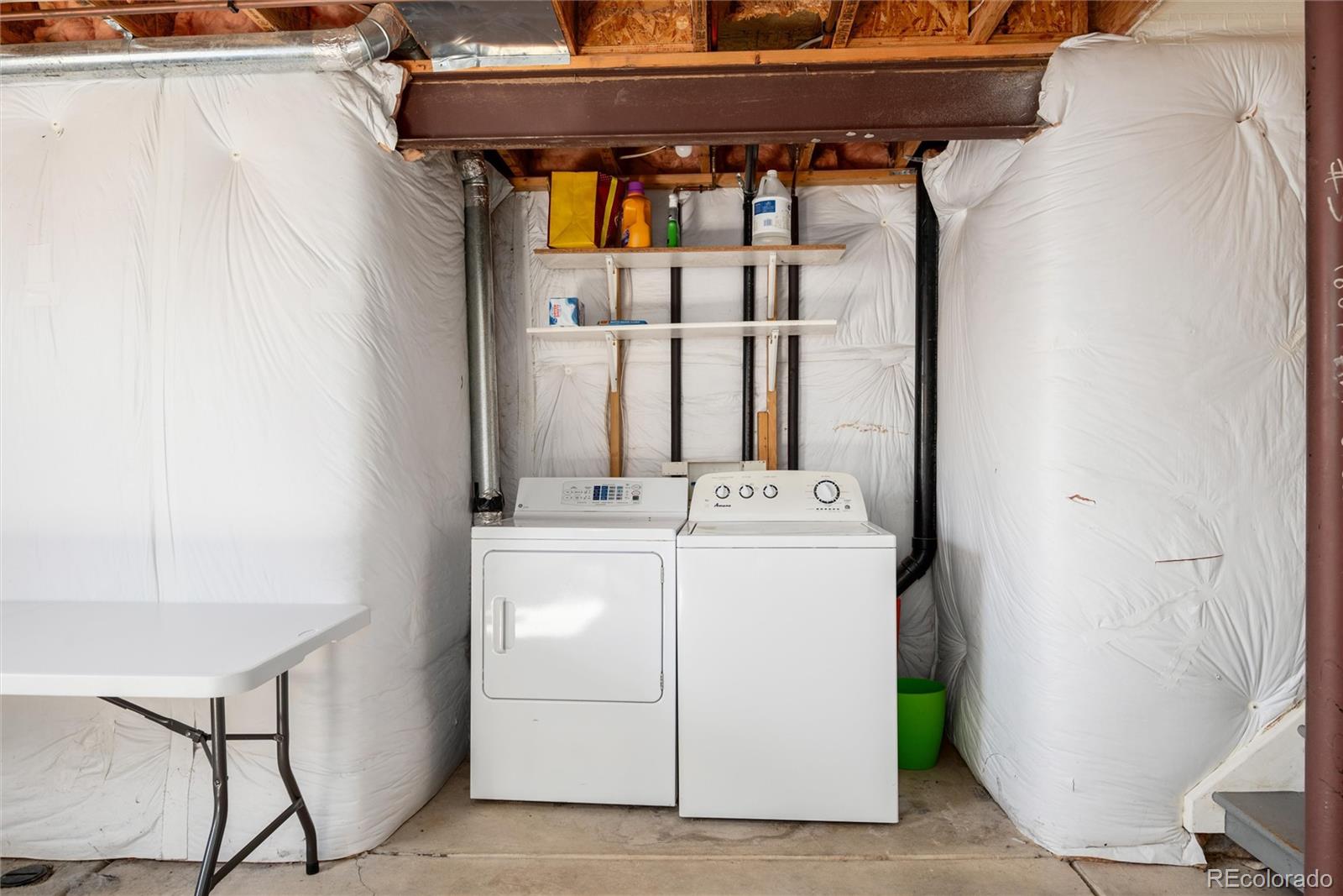 9867 Aftonwood Street Highlands Ranch, CO 80126 - Photo 24 of 41 a utility room with dryer and washer