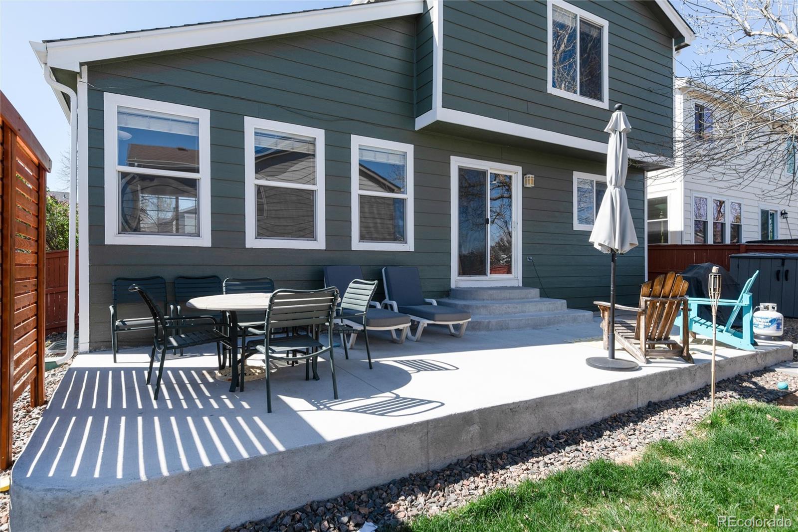 9867 Aftonwood Street Highlands Ranch, CO 80126 - Photo 26 of 41 a view of a house with patio and sitting area