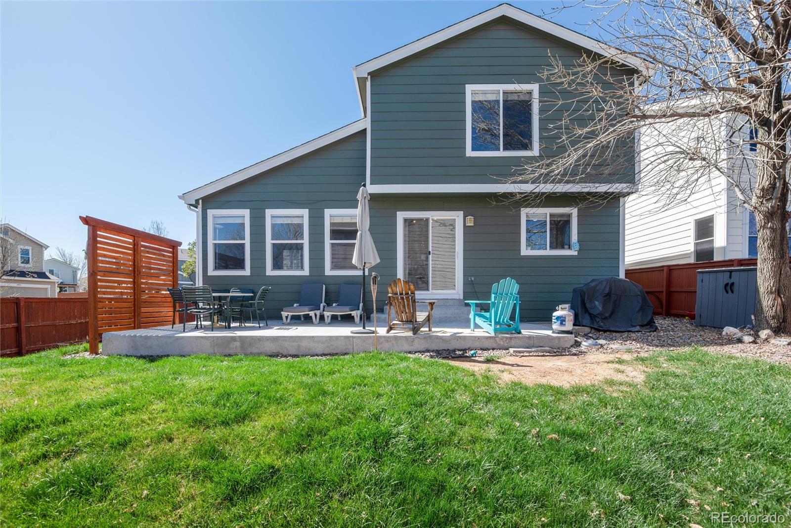 9867 Aftonwood Street Highlands Ranch, CO 80126 - Photo 29 of 41 a house view with a sitting space and garden