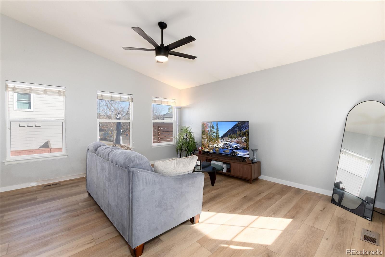 9867 Aftonwood Street Highlands Ranch, CO 80126 - Photo 5 of 41 a living room with furniture and a large window