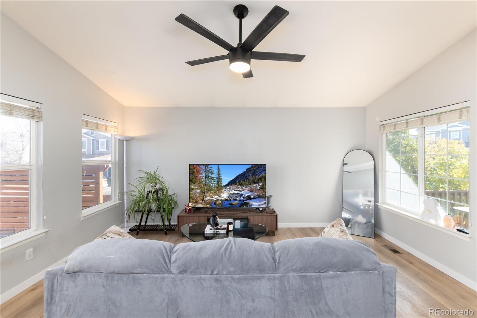 9867 Aftonwood Street Highlands Ranch, CO 80126 - Photo 6 of 41 a living room with furniture and a large window