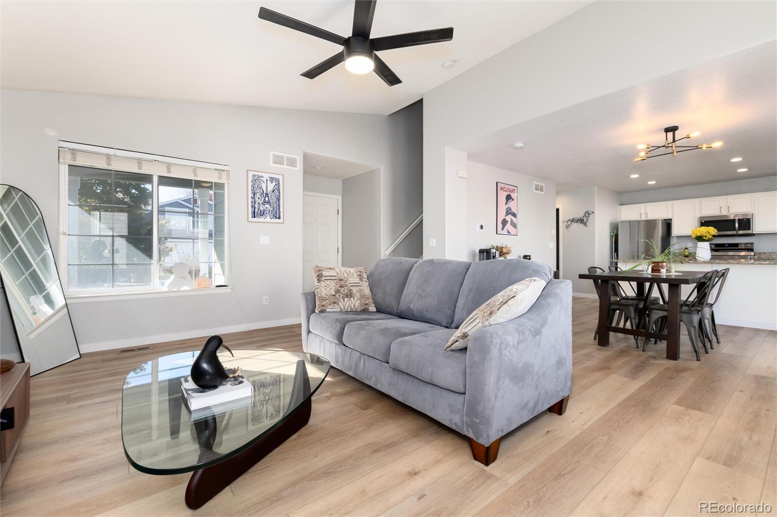 9867 Aftonwood Street Highlands Ranch, CO 80126 - Photo 8 of 41 a living room with furniture and a window