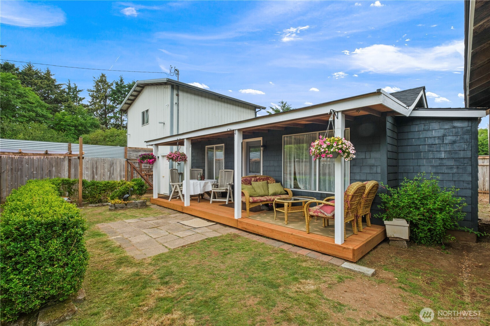 a view of a house with backyard porch and sitting area