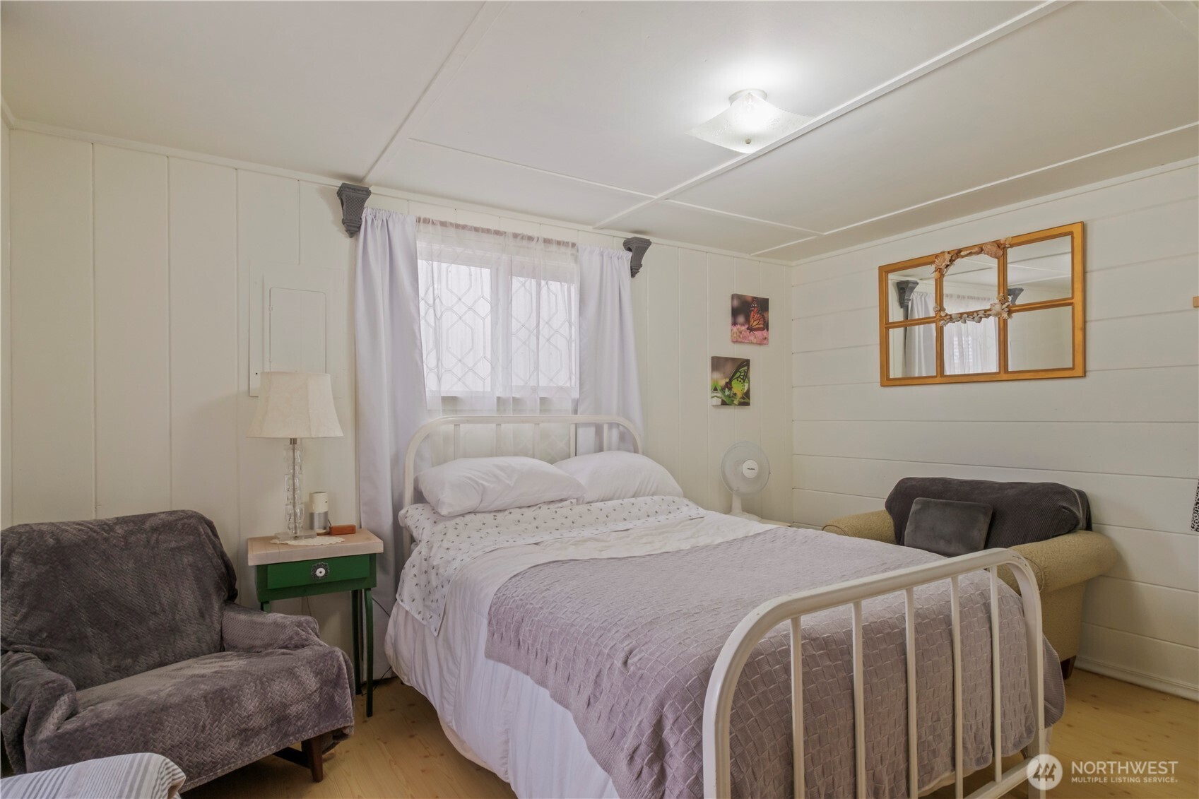 4 Memory Lane Copalis Beach, WA 98535 - Photo 15 of 29 a bedroom with a bed couch and window