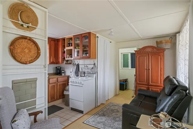 a view of a livingroom with furniture and a fireplace