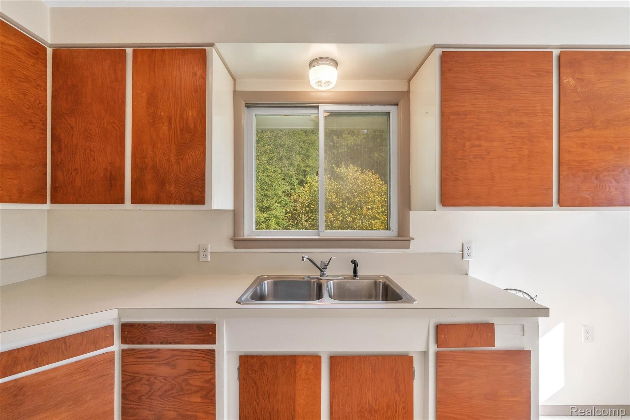 3200 Sexton Road Howell, MI 48843 - Photo 18 of 35 The dreaded dishes are made easier with the view of nature